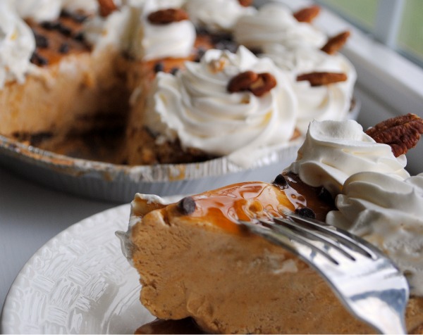 Pumpkin ice cream pie piece and whole pie